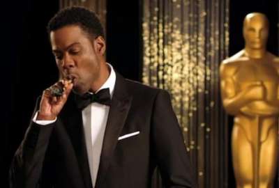 Difunden im&aacute;genes de Chris Rock perplejo tras el golpe de Will Smith